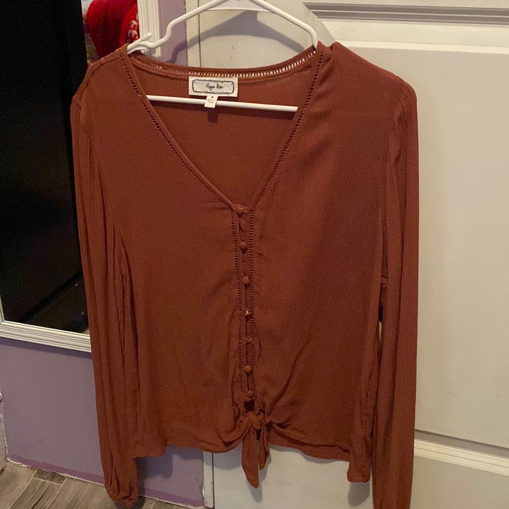 Tan/brown color, feels fresh, fits good as oversize.